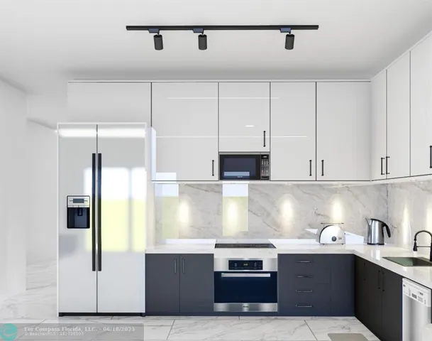 a kitchen with stainless steel appliances granite countertop a sink and white cabinets