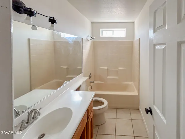 a bathroom with a sink a toilet and a bathtub