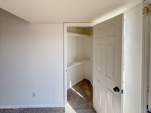 a view of a big room with carpet