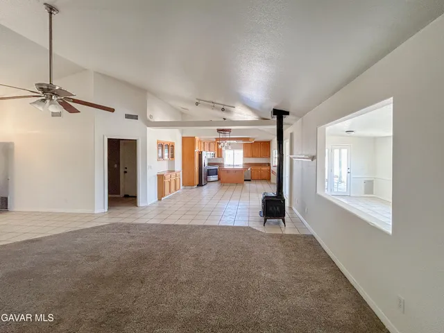 a view of a big room with windows