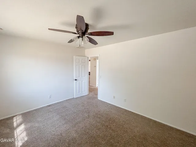 a view of a livingroom with a ceiling fan
