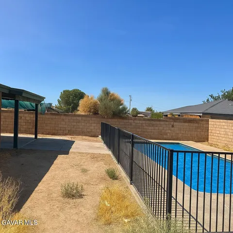 a view of road with large trees