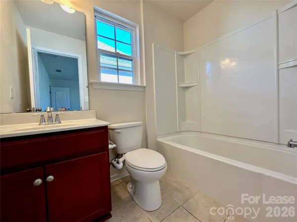 a bathroom with a sink a toilet and a bathtub