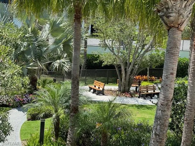 a view of a dinning table and chairs in patio of the house