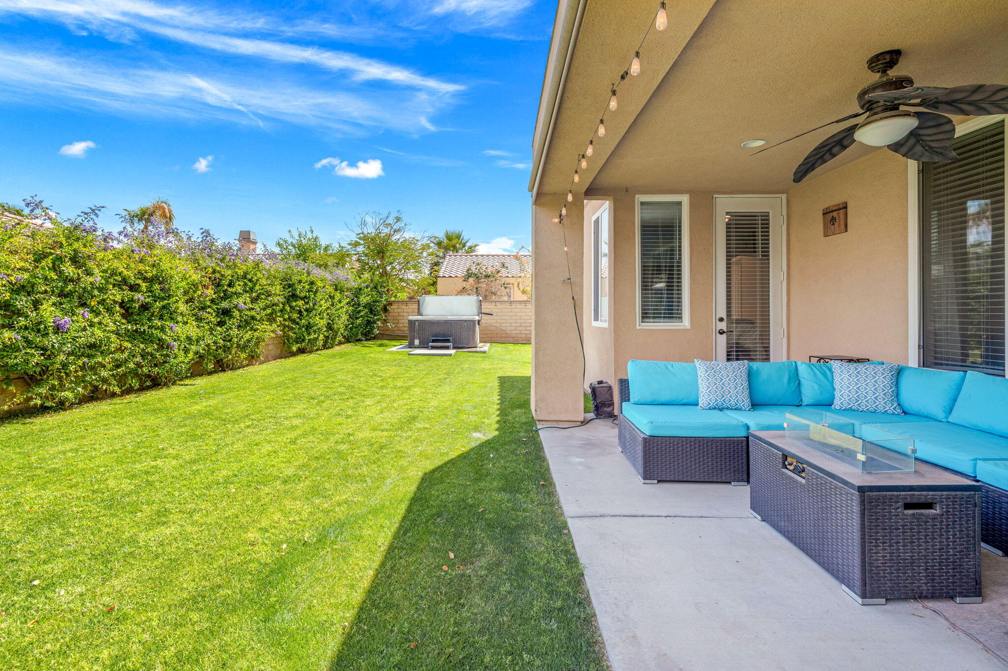79040 Shadow Trail La Quinta, CA 92253 - Photo 14 of 69 a view of a patio with couches chairs and potted plants