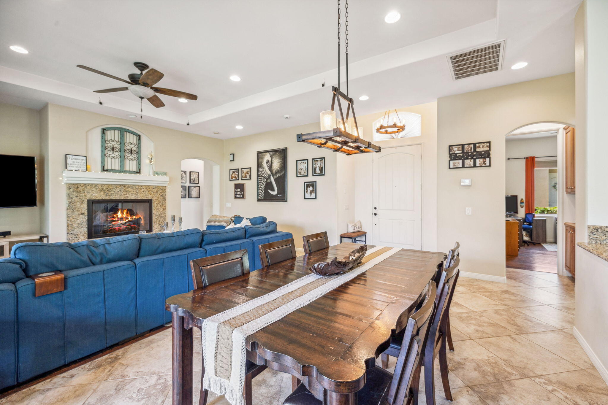 79040 Shadow Trail La Quinta, CA 92253 - Photo 23 of 69 a living room with furniture a fireplace and a flat screen tv