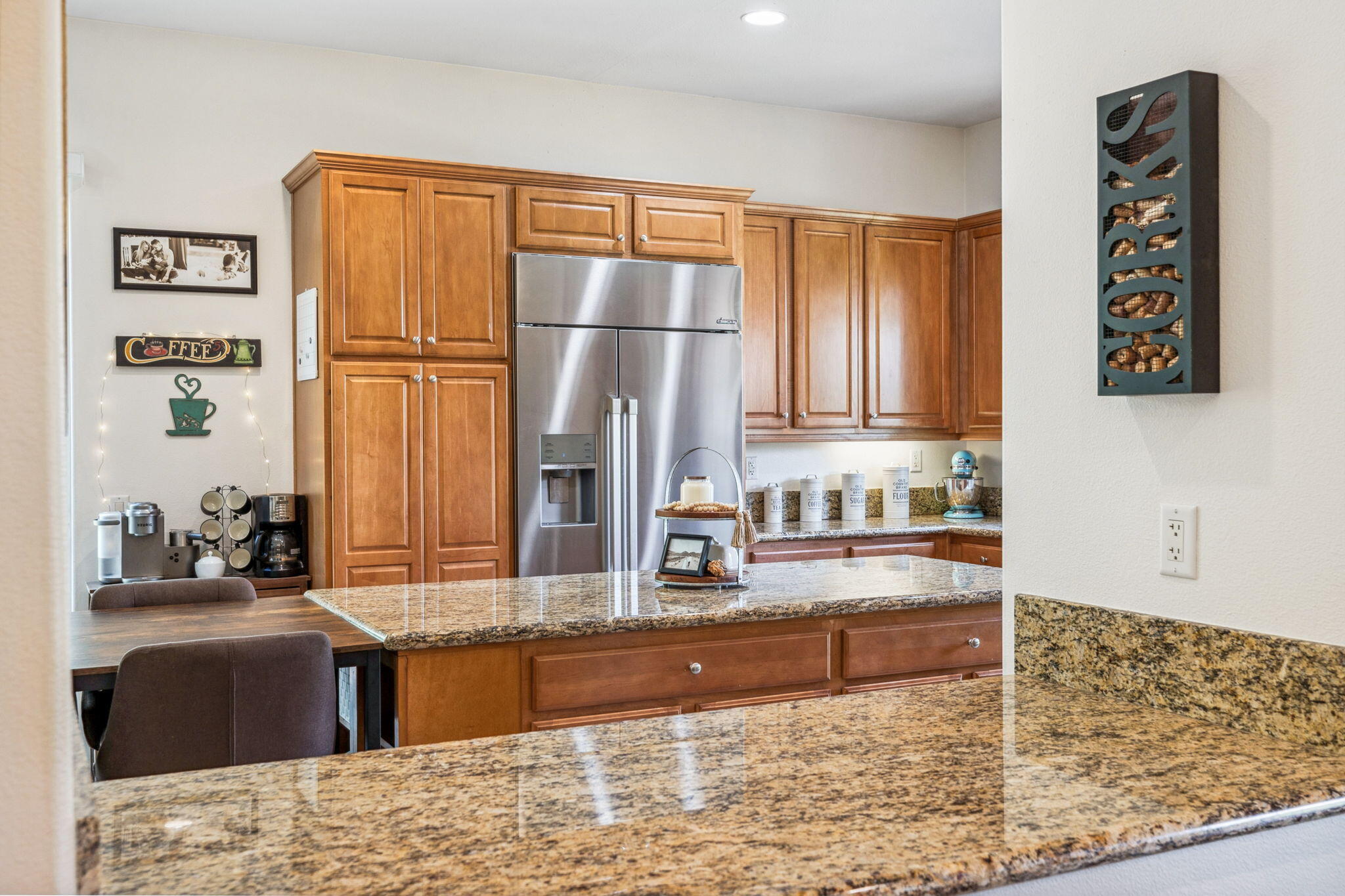 79040 Shadow Trail La Quinta, CA 92253 - Photo 28 of 69 a kitchen with stainless steel appliances granite countertop a refrigerator and a sink