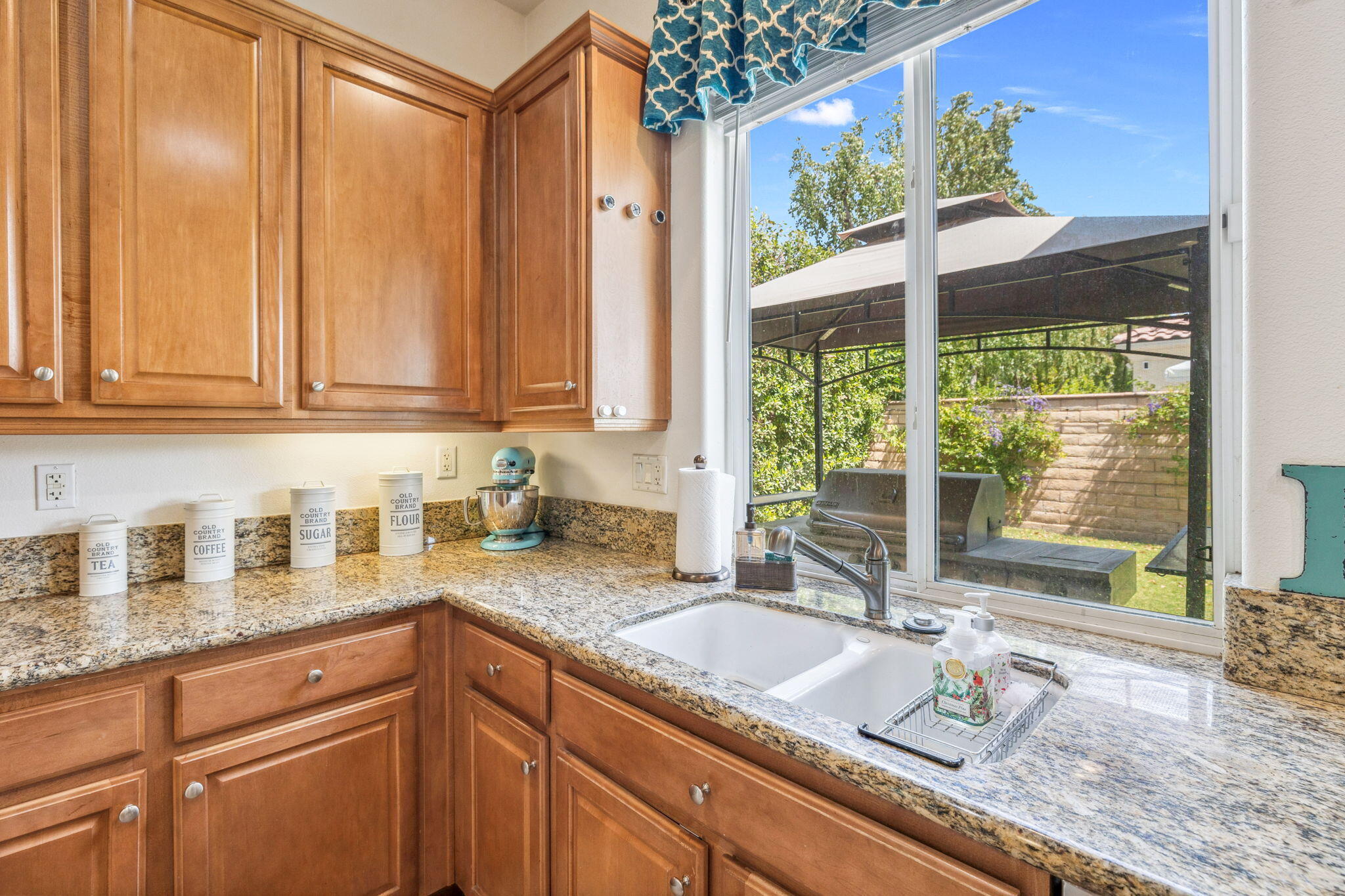 79040 Shadow Trail La Quinta, CA 92253 - Photo 30 of 69 a kitchen with granite countertop a sink and a window