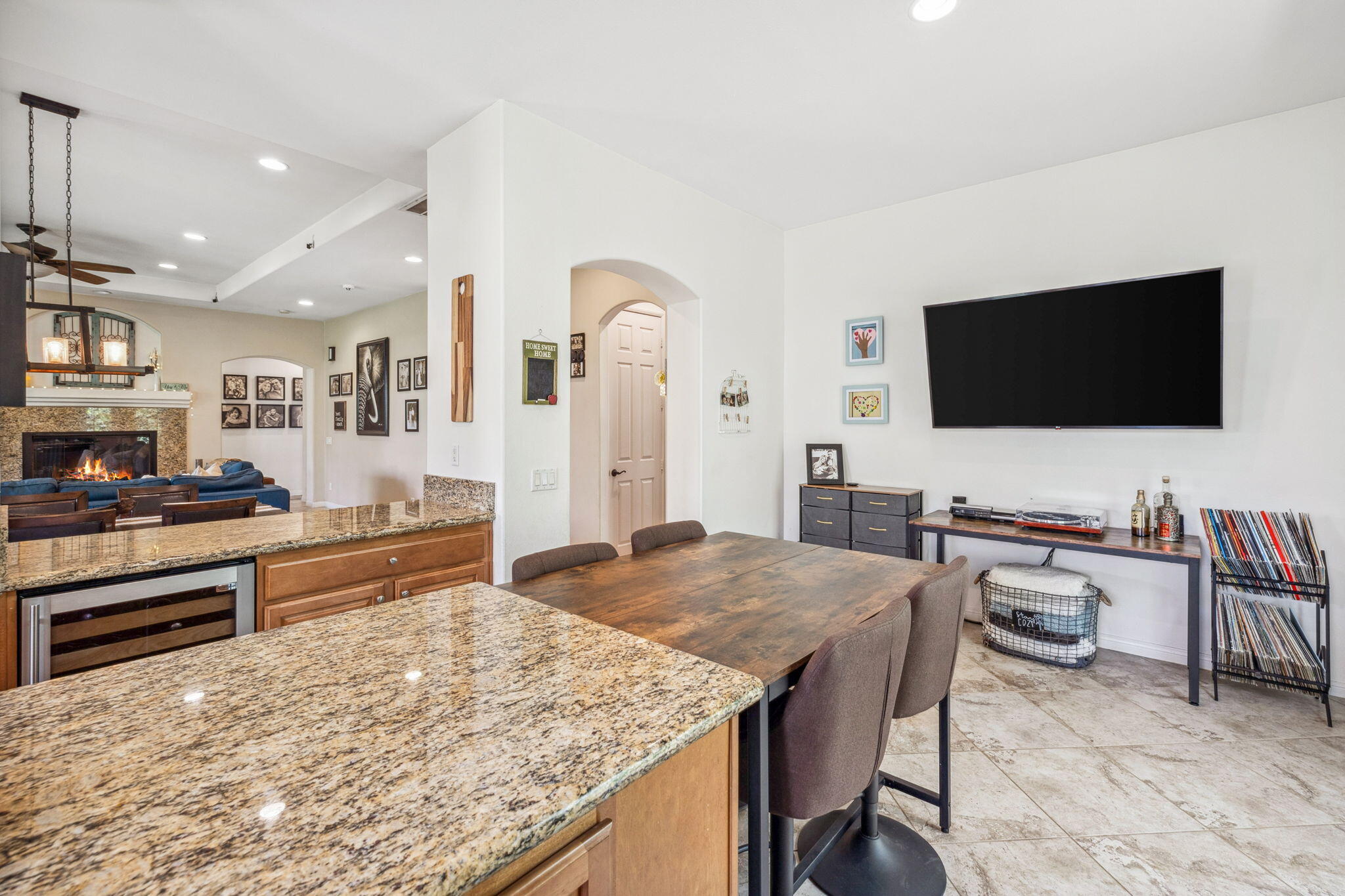 79040 Shadow Trail La Quinta, CA 92253 - Photo 35 of 69 a living room with stainless steel appliances kitchen island granite countertop furniture and a flat screen tv