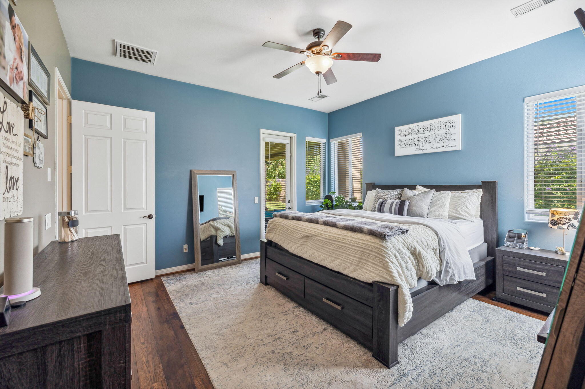 79040 Shadow Trail La Quinta, CA 92253 - Photo 40 of 69 a spacious bedroom with a bed a dresser and wooden floor