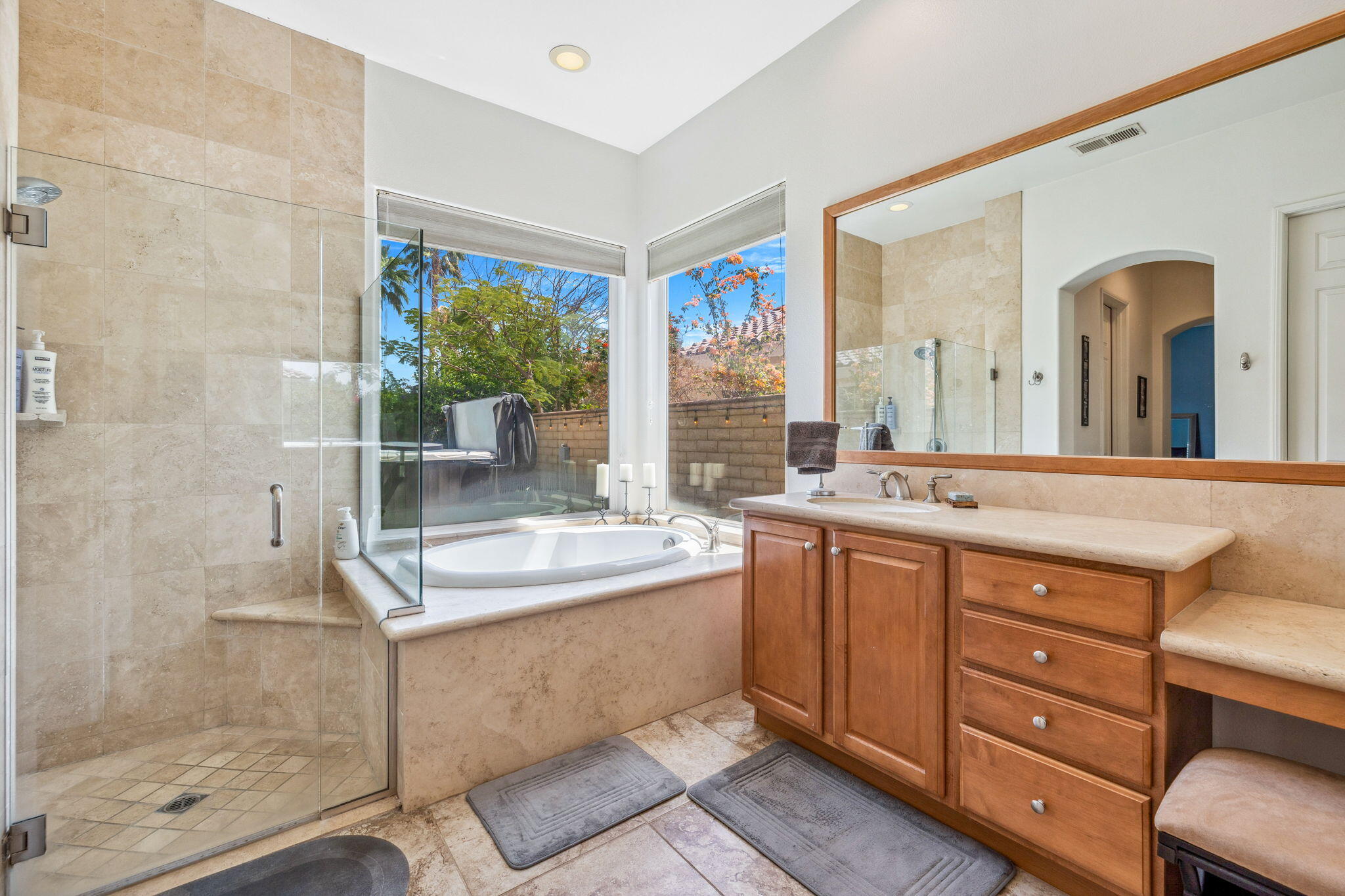 79040 Shadow Trail La Quinta, CA 92253 - Photo 43 of 69 a bathroom with a granite countertop sink mirror and shower