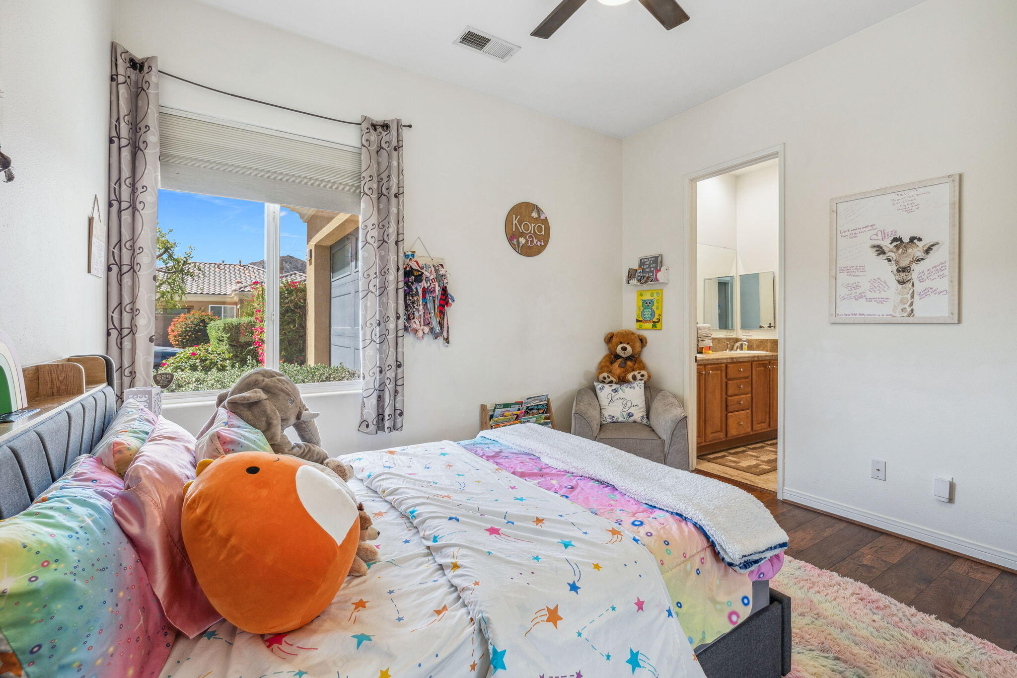79040 Shadow Trail La Quinta, CA 92253 - Photo 48 of 69 a bedroom with a bed a window and wall painting