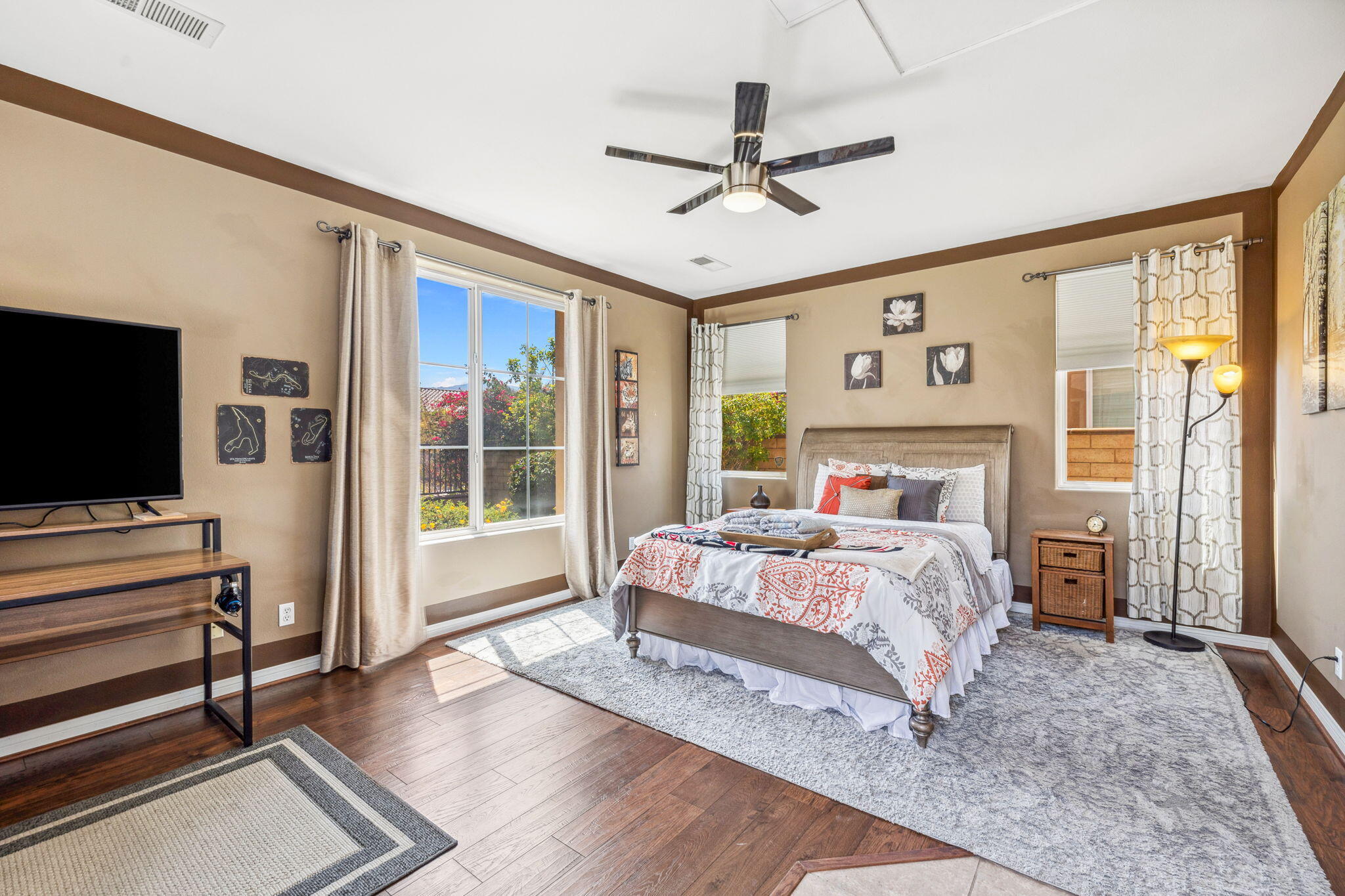 79040 Shadow Trail La Quinta, CA 92253 - Photo 58 of 69 a bedroom with a large bed and a flat screen tv