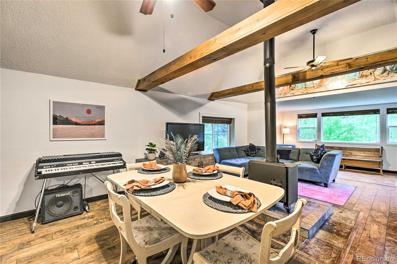7559 South Turkey Creek Road Morrison, CO 80465 - Photo 11 of 40 a living room with furniture and a floor to ceiling window