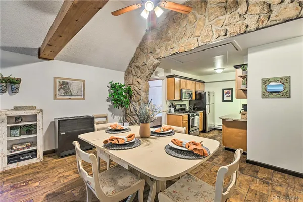 a kitchen with stainless steel appliances granite countertop a stove a refrigerator and a microwave
