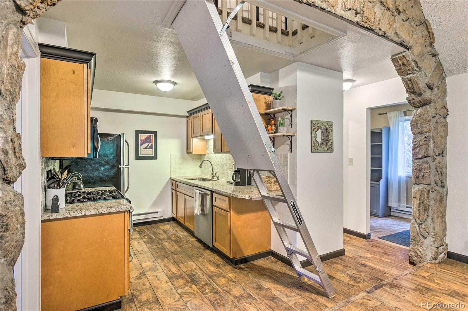 7559 South Turkey Creek Road Morrison, CO 80465 - Photo 15 of 40 a view of a livingroom with furniture a bedroom and windows