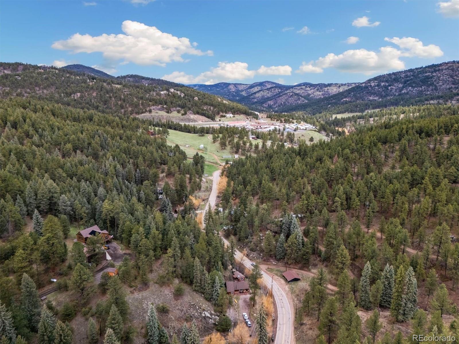 7559 South Turkey Creek Road Morrison, CO 80465 - Photo 3 of 43 a view of a city with mountains in the background