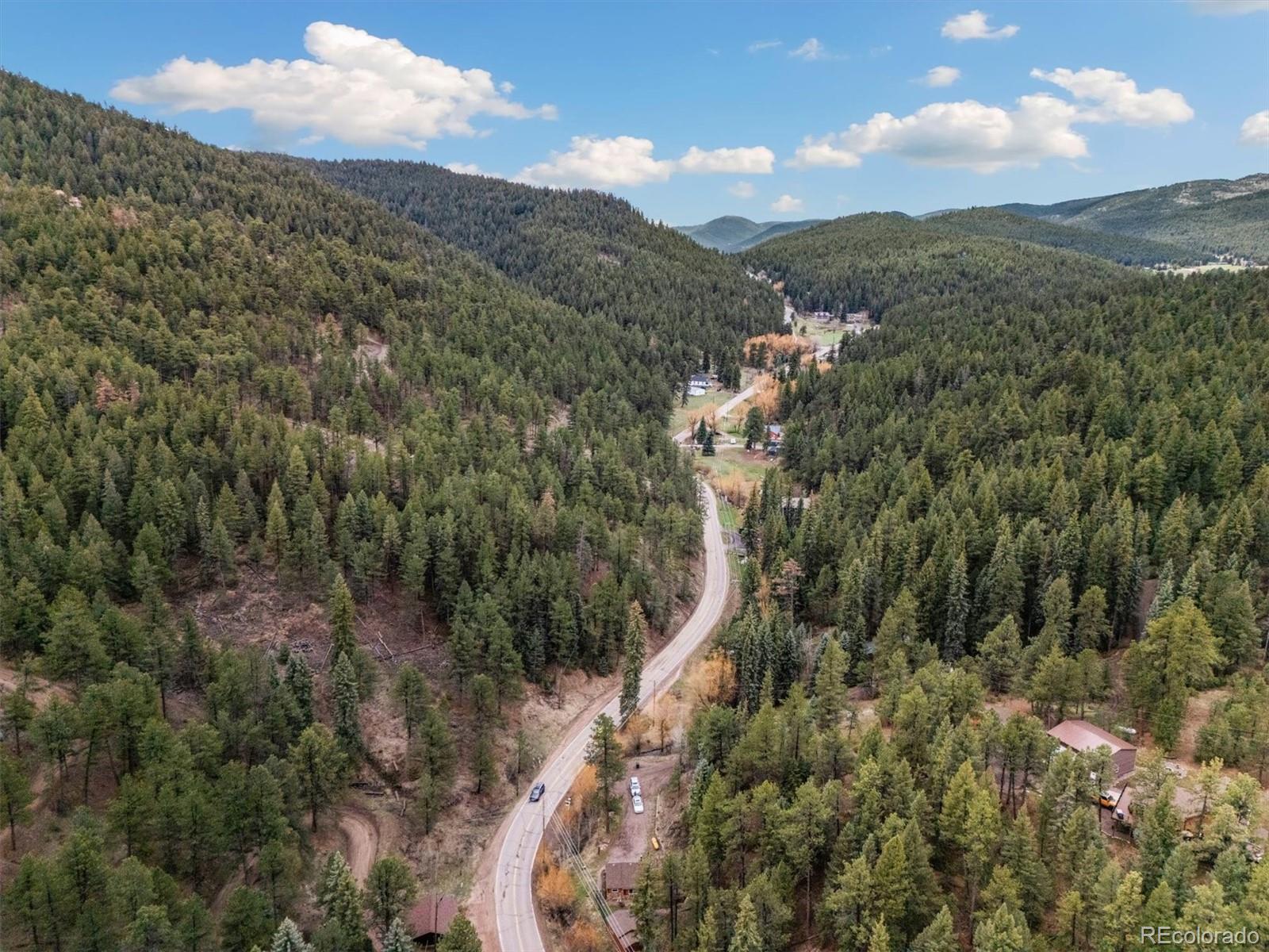 7559 South Turkey Creek Road Morrison, CO 80465 - Photo 38 of 40 a view of a city with lush green forest
