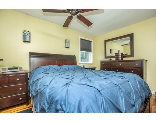 40 Woodruff Road Walpole, MA 02081 - Photo 16 of 31 a bedroom with a bed and wooden floor