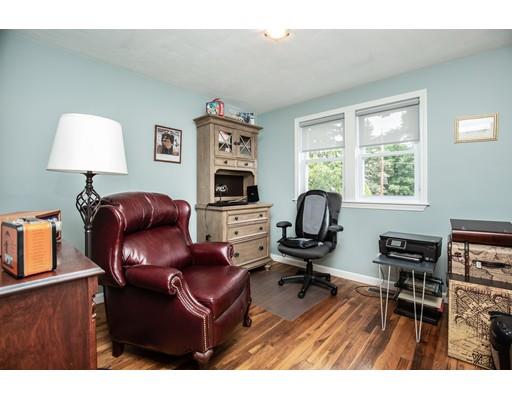 40 Woodruff Road Walpole, MA 02081 - Photo 18 of 31 a living room with furniture a piano and a window
