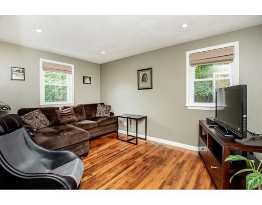 40 Woodruff Road Walpole, MA 02081 - Photo 19 of 31 a living room with furniture a window and a flat screen tv
