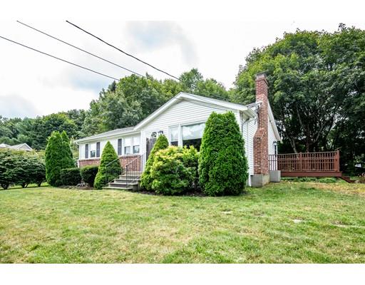 40 Woodruff Road Walpole, MA 02081 - Photo 2 of 31 a front view of a house with a yard