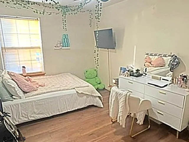 a bedroom with a bed and furniture