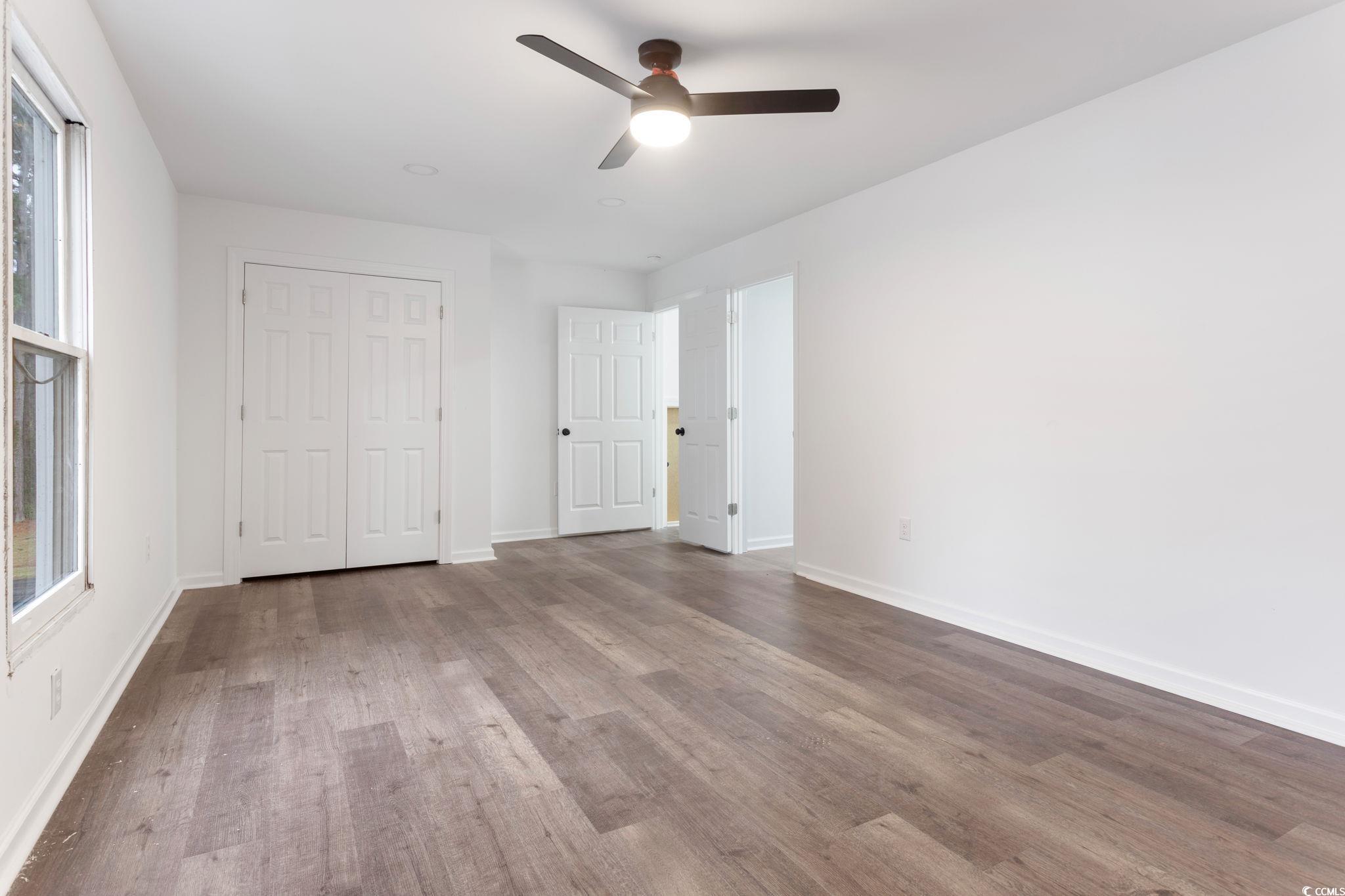 2321 Brick Drive Longs, SC 29568 - Photo 38 of 40 Unfurnished bedroom with a ceiling fan, a closet, and wood finished floors