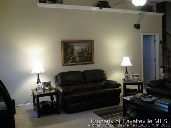 49 Germantown Road Cameron, NC 28326 - Photo 14 of 25 a living room with furniture and a lamp
