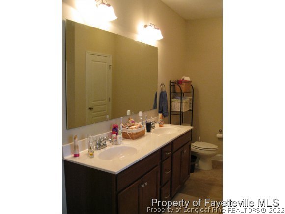 49 Germantown Road Cameron, NC 28326 - Photo 17 of 25 a bathroom with a sink and a mirror