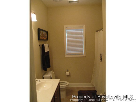 49 Germantown Road Cameron, NC 28326 - Photo 20 of 25 a bathroom with a sink and a mirror