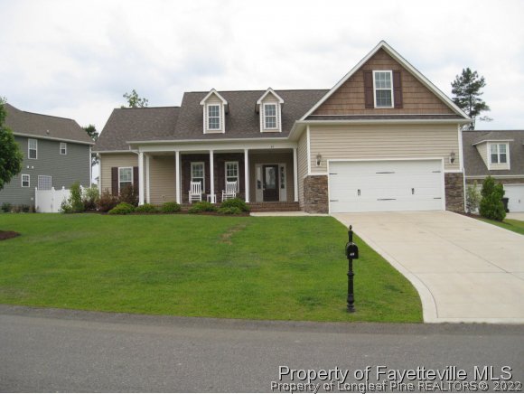 49 Germantown Road Cameron, NC 28326 - Photo 2 of 25 a front view of a house with garden