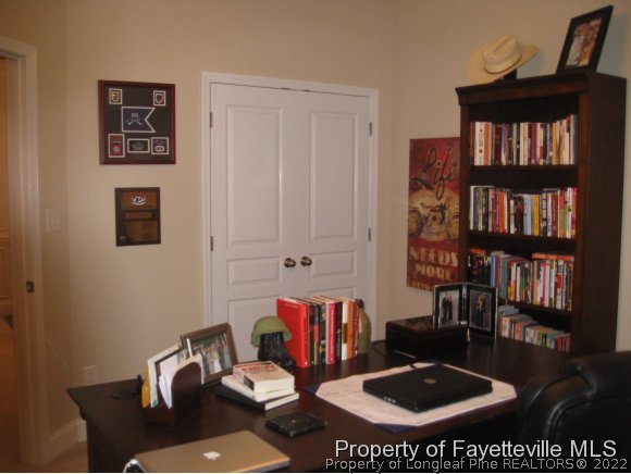 49 Germantown Road Cameron, NC 28326 - Photo 21 of 25 a living room with furniture and a book shelf