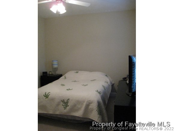 49 Germantown Road Cameron, NC 28326 - Photo 22 of 25 a bedroom with a bed and a view of cupboard