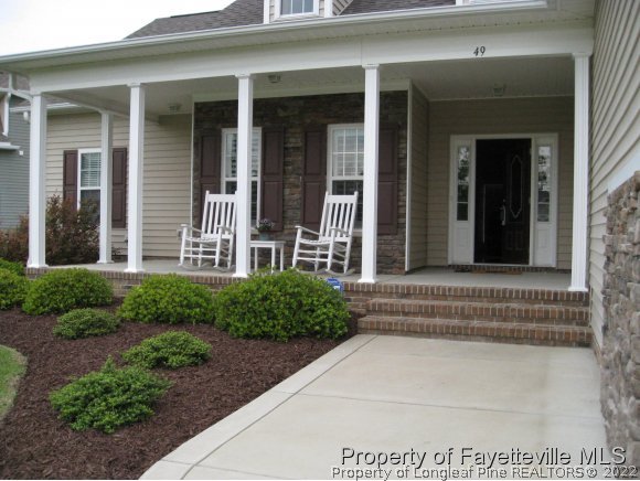 49 Germantown Road Cameron, NC 28326 - Photo 5 of 25 front view of a house with a bench