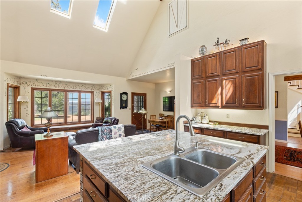 5555 Platt Mountain Road Forest Ranch, CA 95942 - Photo 15 of 55 a kitchen with granite countertop a sink and a stove top oven