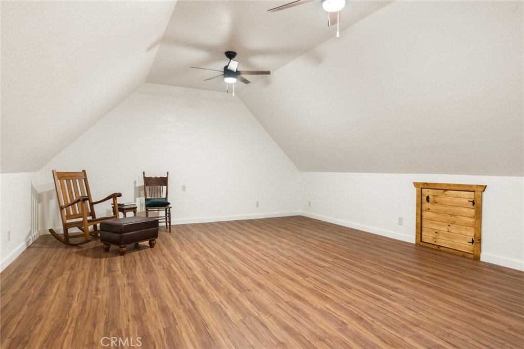 5555 Platt Mountain Road Forest Ranch, CA 95942 - Photo 31 of 55 a living room with furniture and wooden floor