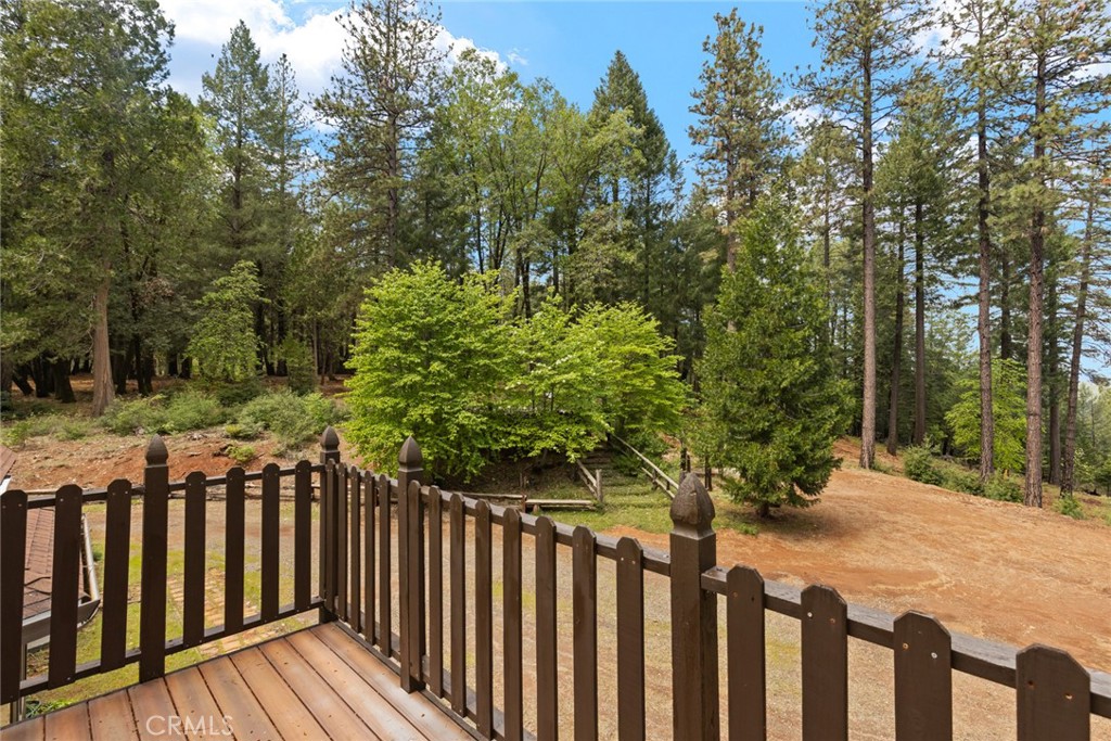 5555 Platt Mountain Road Forest Ranch, CA 95942 - Photo 43 of 55 a wooden fence with trees in the background