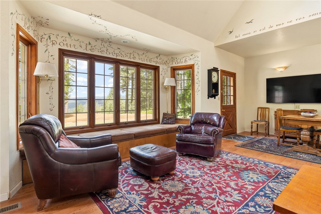 5555 Platt Mountain Road Forest Ranch, CA 95942 - Photo 10 of 55 a living room with furniture and a flat screen tv