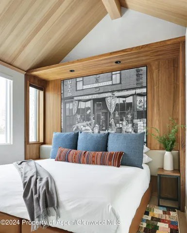 a bed room with a bed and window