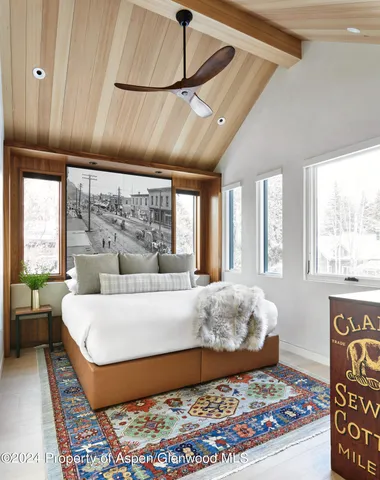 a living room with a bed and a couch