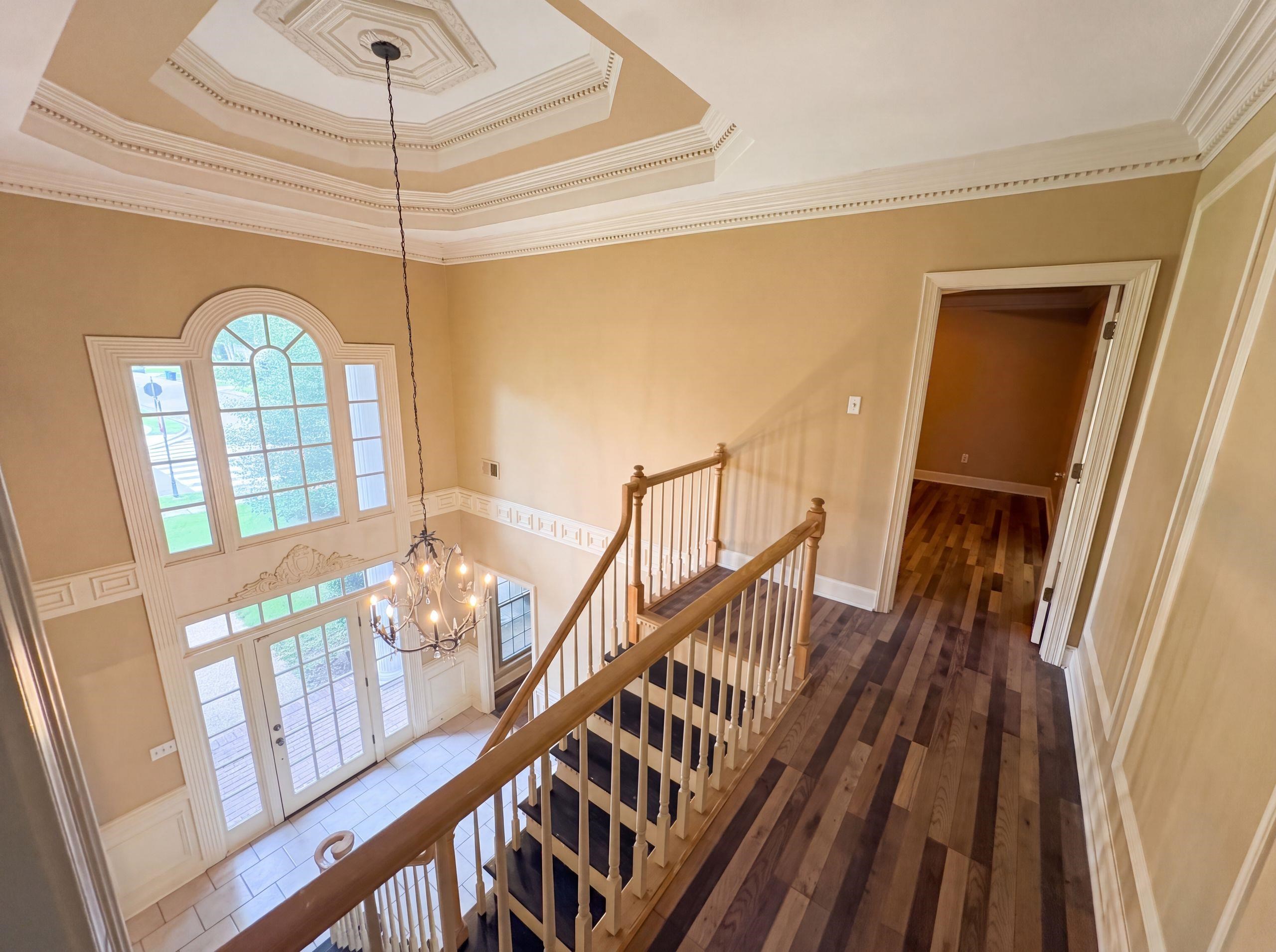 9424 Gotten Road Germantown, TN 38139 - Photo 26 of 27 Two-story foyer with a decorative octagonal tray ceiling, chandelier, and a large arched window above double entry doors