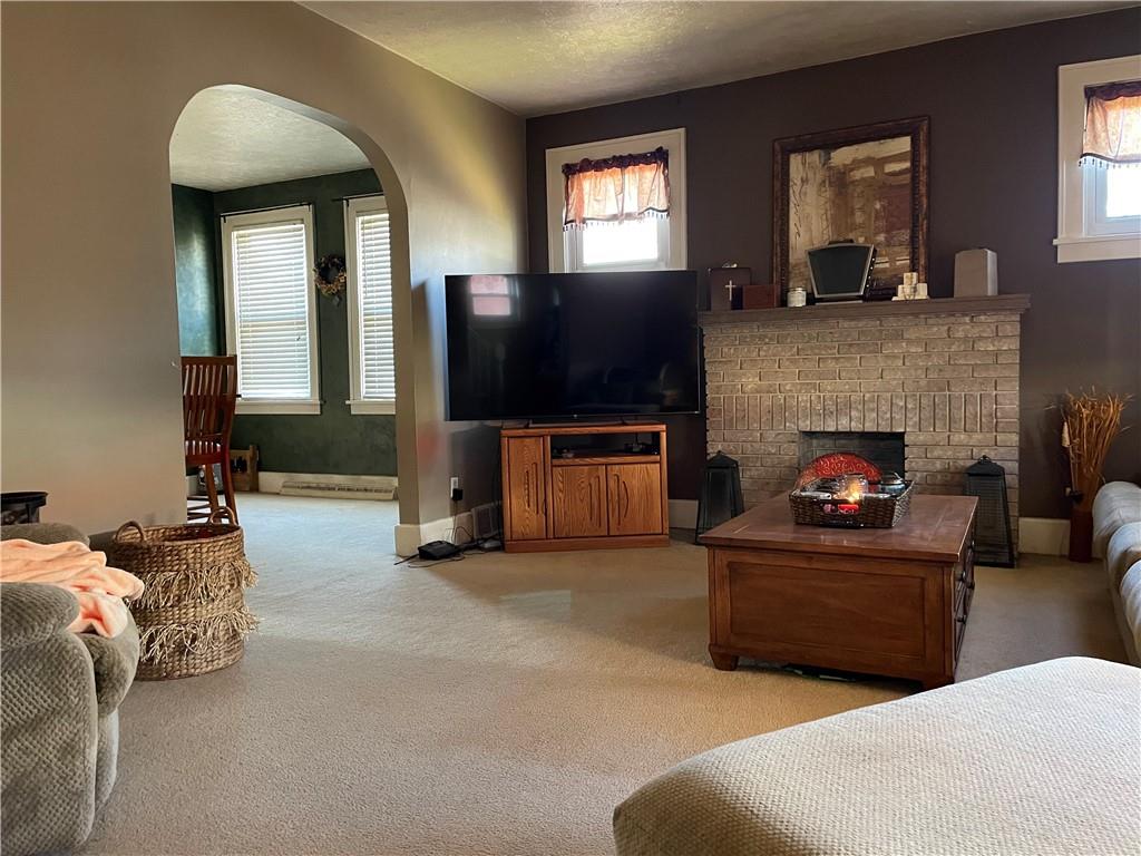 321 Elm Road Ambridge, PA 15003 - Photo 4 of 25 a living room with furniture and a fireplace