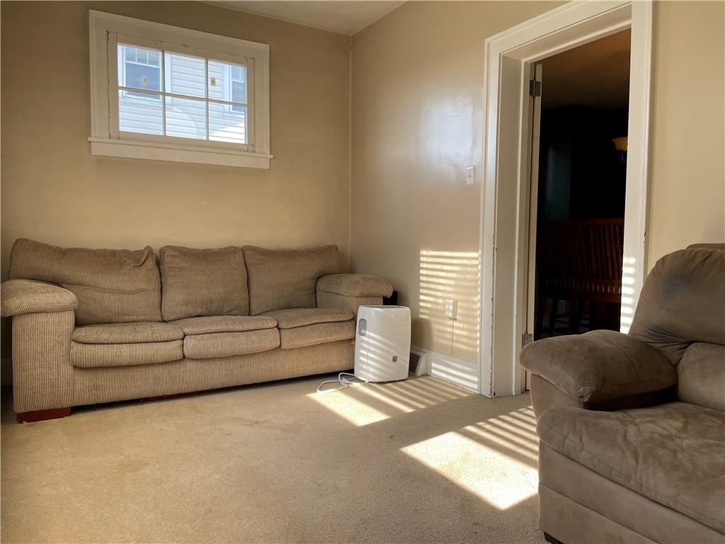 321 Elm Road Ambridge, PA 15003 - Photo 6 of 25 a living room with furniture and a window