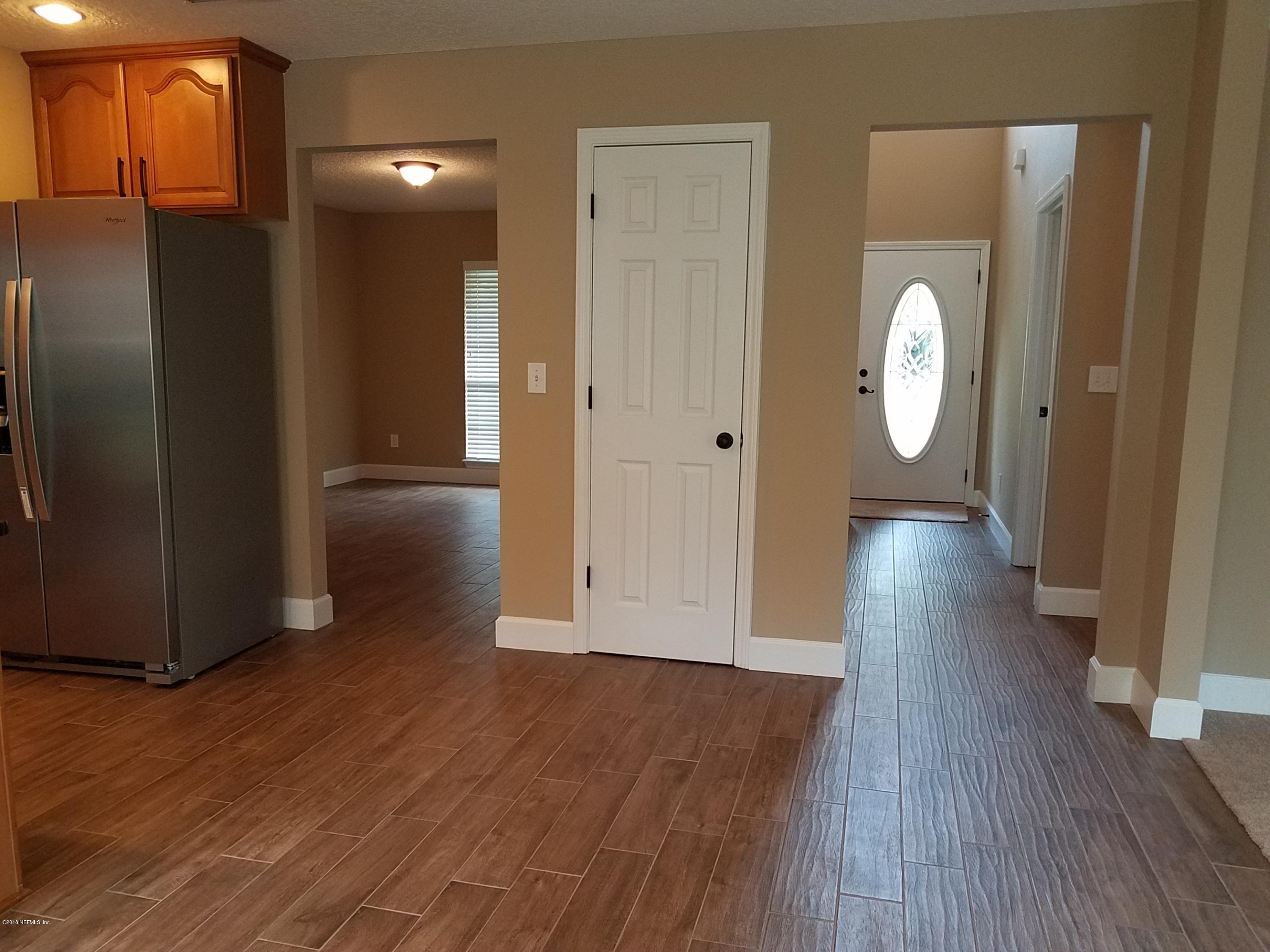 920 Silver Spring Court St. Augustine, FL 32092 - Photo 21 of 24 kitchen looking into foyer and flex room