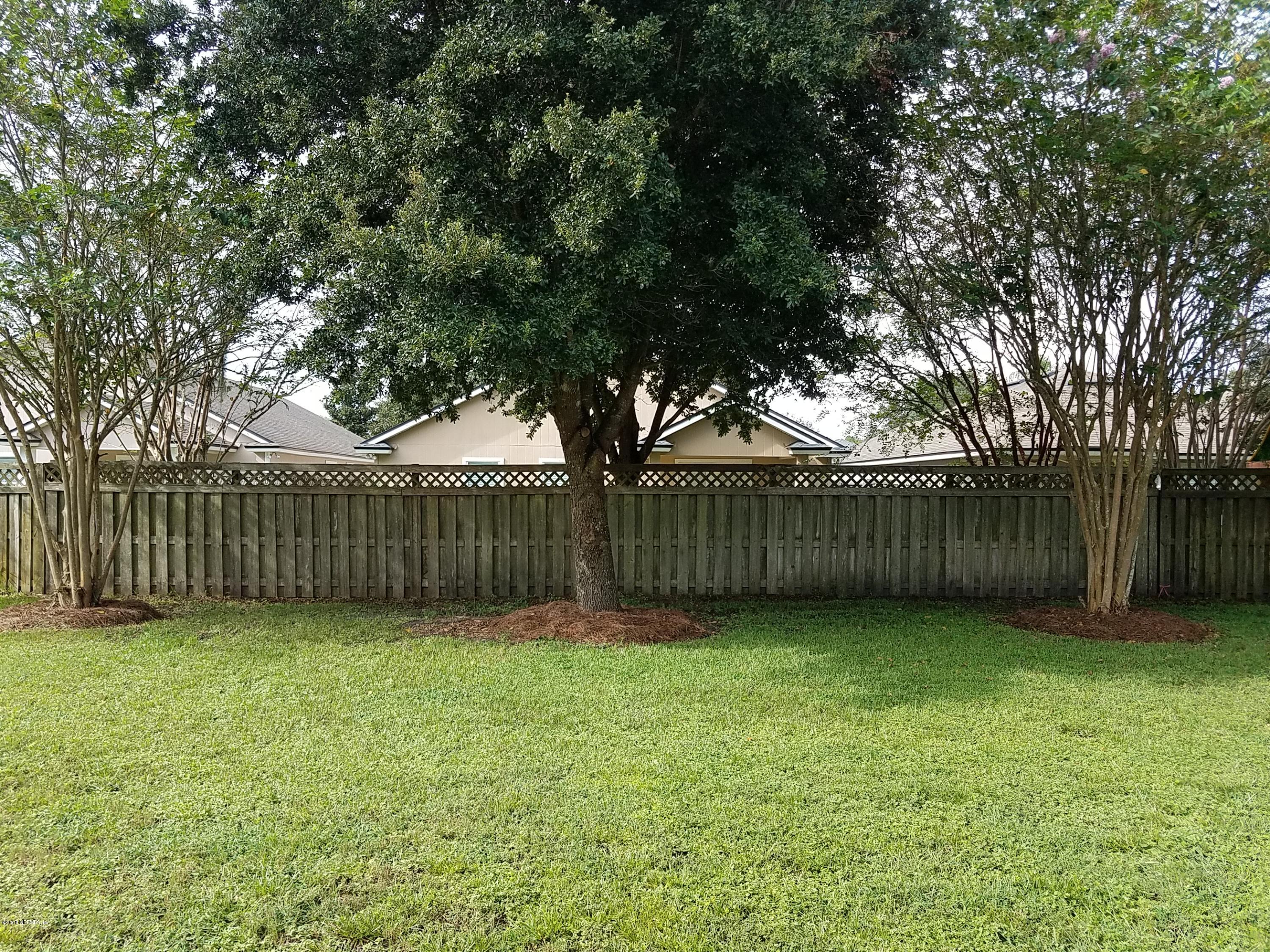 920 Silver Spring Court St. Augustine, FL 32092 - Photo 4 of 24 backyard view from covered lanai