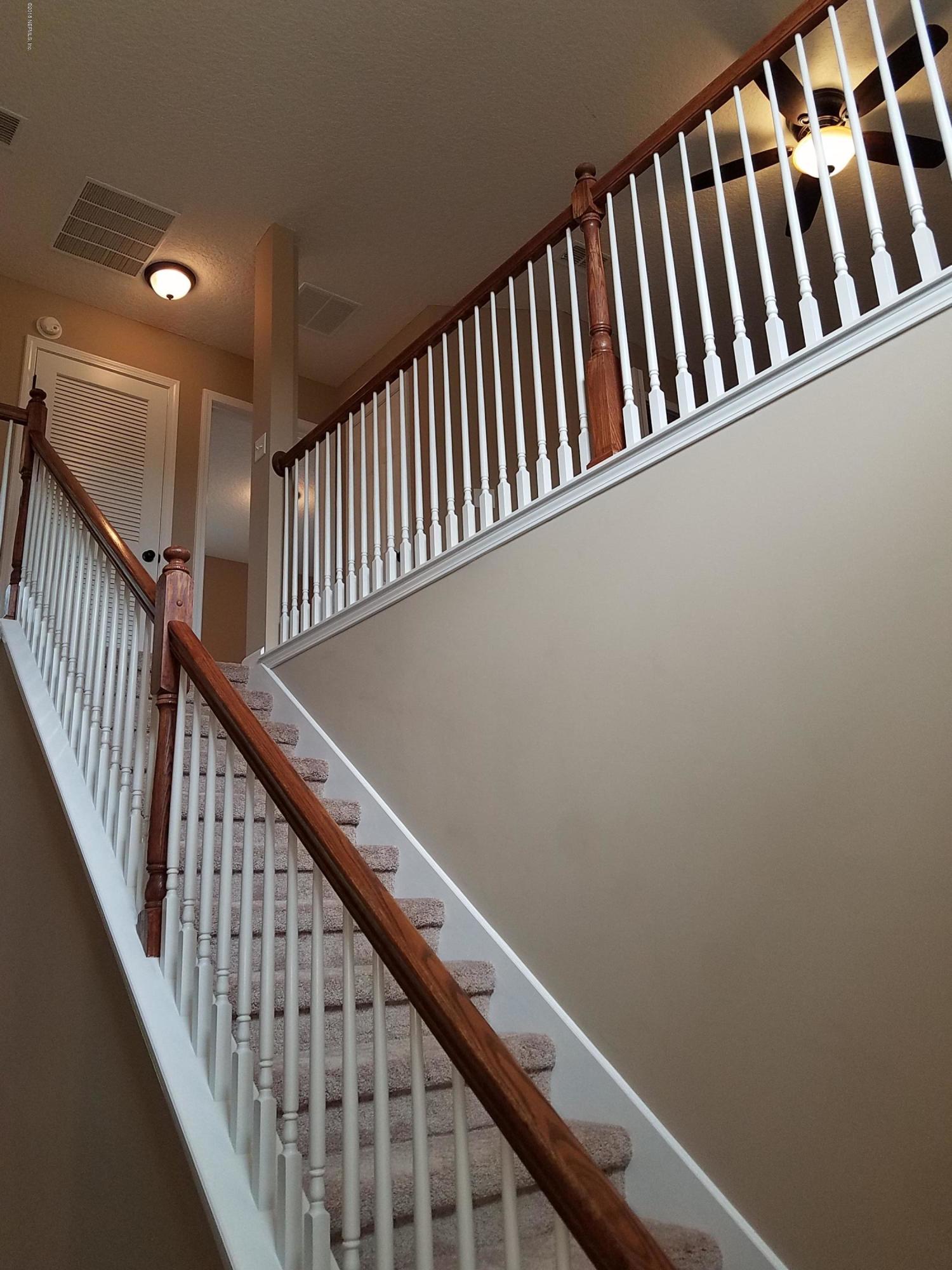 920 Silver Spring Court St. Augustine, FL 32092 - Photo 5 of 24 staircase at entryway looking up