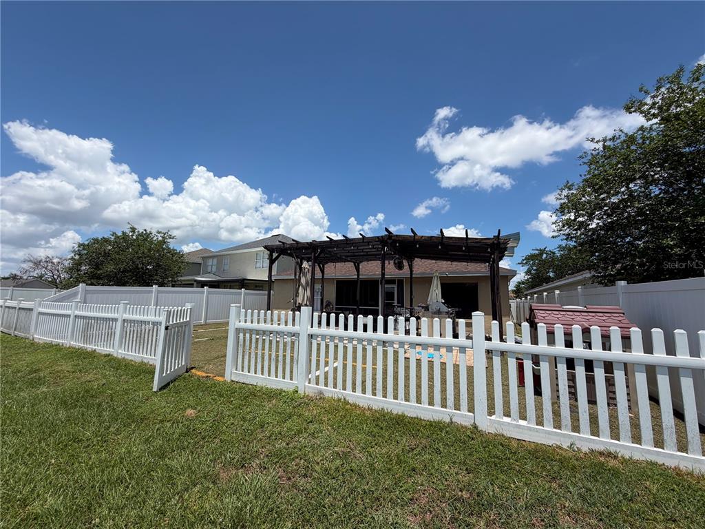 945 Tramells Trail Kissimmee, FL 34744 - Photo 35 of 36 a view of a house with a yard