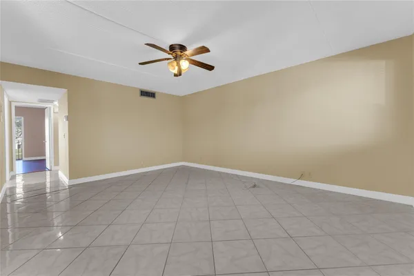 a kitchen with stainless steel appliances granite countertop a refrigerator and a stove