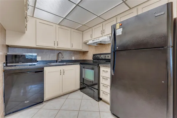 a view of an empty room and wooden floor